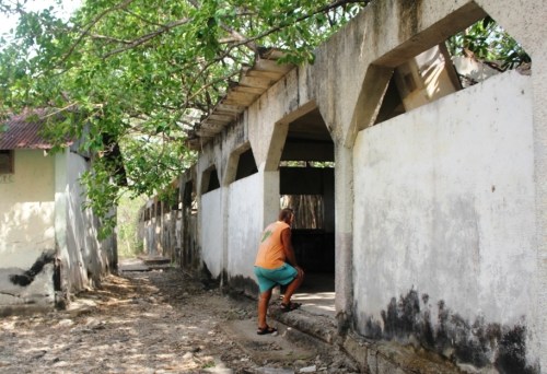 Tom peeking in one of the dormitories, trying to imagine what life was in here.