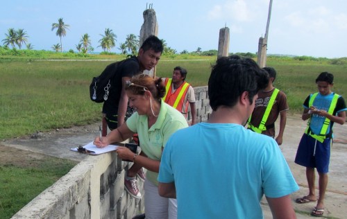 Me signing the passenger manifest
