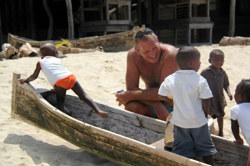 The kids of Cayo Grande gather around Tom